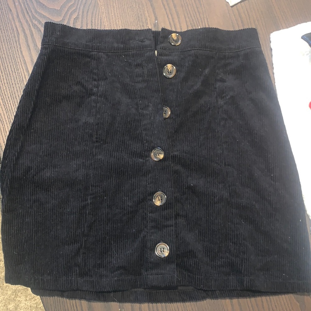 Black mini skirt with buttons